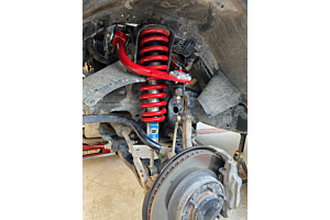 Full view of a red JBA Offroad upper control arm.