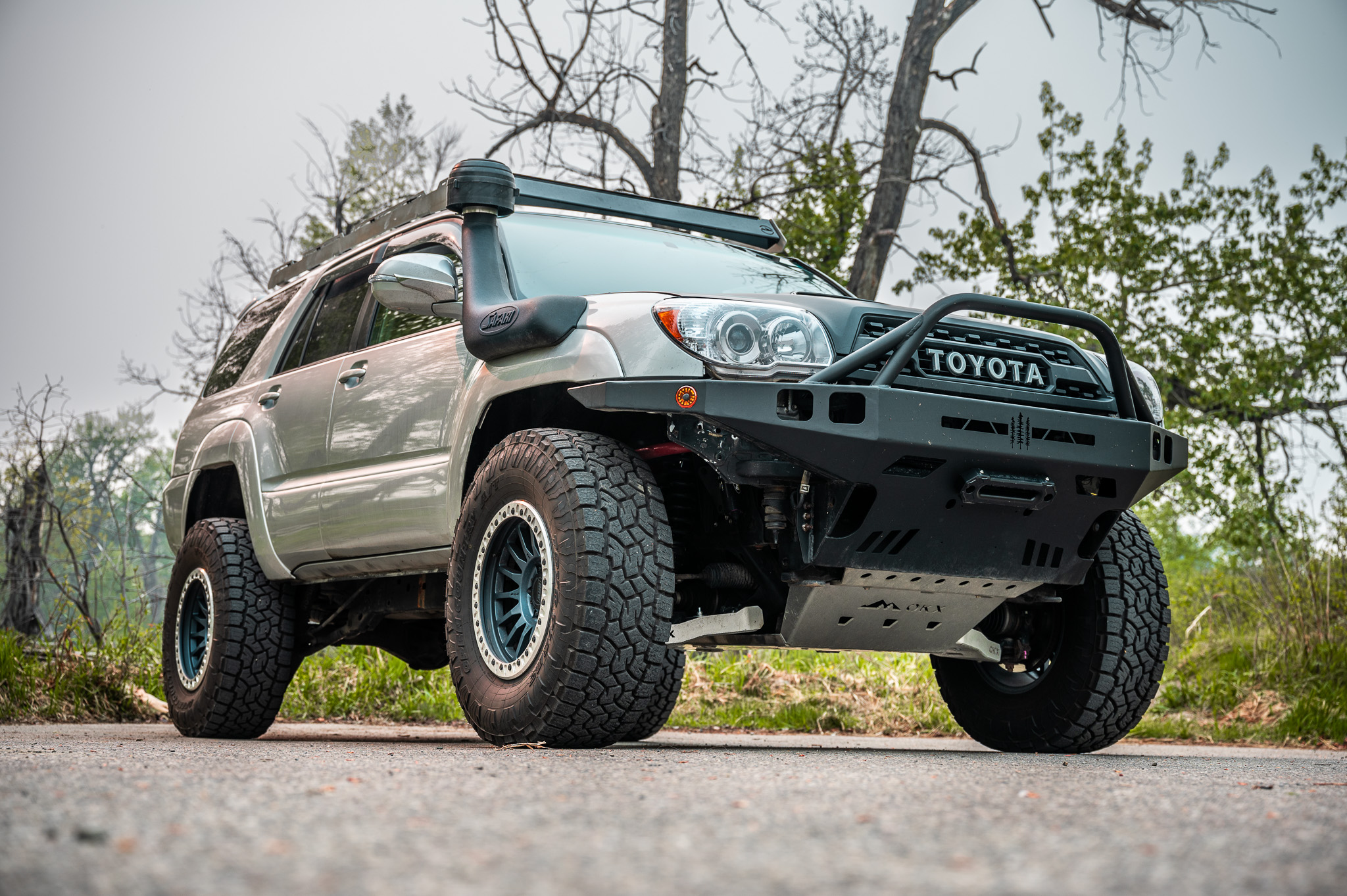 Lifted Toyota 4Runner in the mountains on a sunny day. 